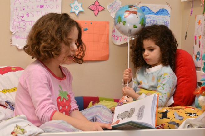 reading a bed-time story photo by Galit Lewinski